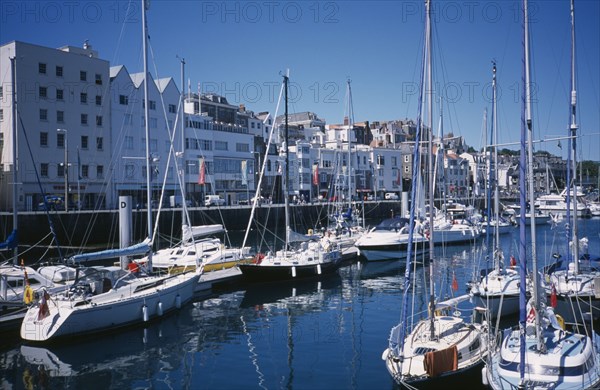 UNITED KINGDOM, Channel Islands, Guernsey, St Peter Port. Victoria Marina yachts and quayside buildings.