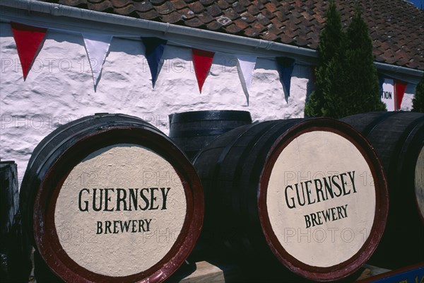 UNITED KINGDOM, Channel Islands, Guernsey, Forest Parish. German Occupation Museum. Brewery barrels displayed outside main entrance.