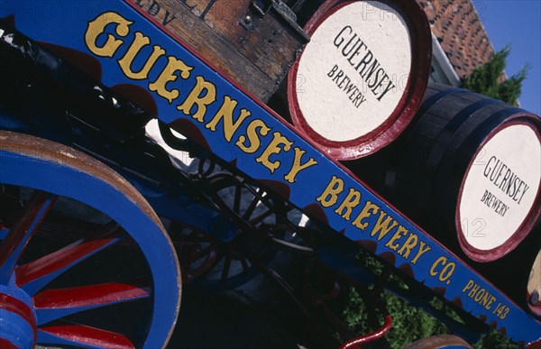 UNITED KINGDOM, Channel Islands, Guernsey, Forest Parish. German Occupation Museum. Detail of Brewery barrels on cart displayed outside main entrance.