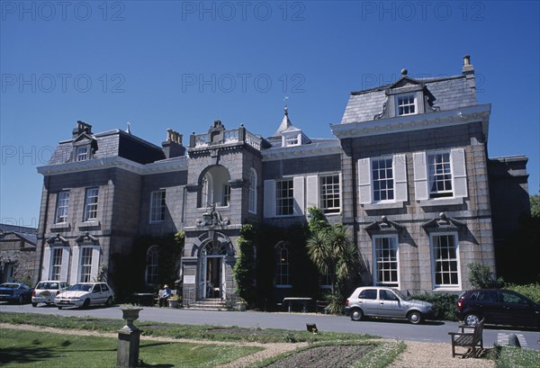 UNITED KINGDOM, Channel Islands, Guernsey, St Martins. Saumarez House. View of front entrance from garden.