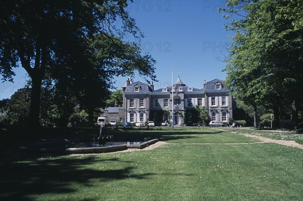 UNITED KINGDOM, Channel Islands, Guernsey, St Martins. Saumarez House. View of front entrance from green lawn.