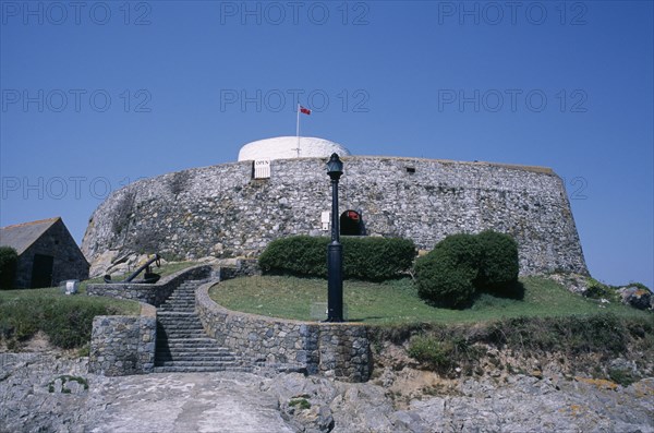 UNITED KINGDOM, Channel Islands, Guernsey, St Peters. Fort Grey Martello Tower and Shipwreck Museum. Also known as the Chateau de Rocquaine or the Cup and Saucer.