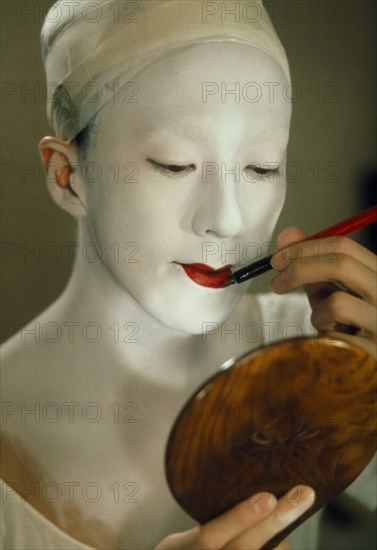 JAPAN, Traditional Theatre, Kabuki actor applying make up.  Female actors are banned as immoral and their roles taken by male onnagata or female role specialists.