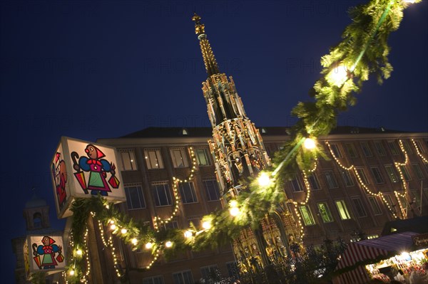 GERMANY, Bavaria, Nuremberg, The Hauptmarkt during the Christmas Market with lights and decorations.