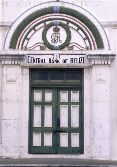 BELIZE, Belize City, The front door of the central bank with a crest in the archway above and columns either side.