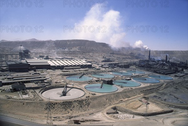 CHILE, Antofagasta, Chuquicamata, "Copper Mine, smoke coming out of a stack in the distance. General industrial landscape."