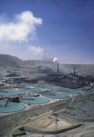 CHILE, Antofagasta, Chuquicamata, Copper Mine with smoke coming out of a stack in the distance.