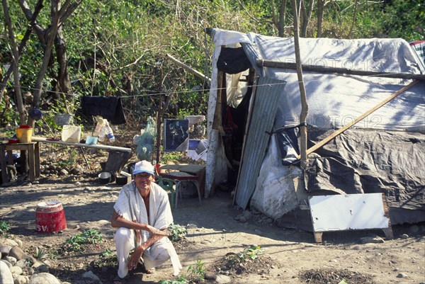 COLOMBIA, Yopal, "Squatter, attracted by oil boom, outside his temporary housing."