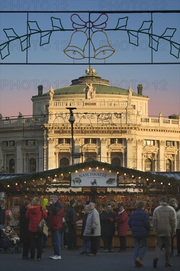 AUSTRIA, Lower Austria, Vienna, The Rathaus Christmas Market with The Burgtheater in the background.