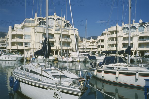 SPAIN, Andalucia, Benalmadena, Award winning marina project in Europe. Boats docked with buildings behind.Costa del Sol