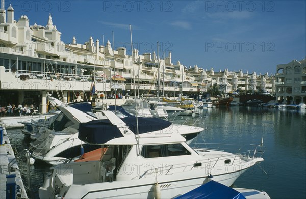SPAIN, Andalucia, Benalmadena, Award winning marina project in Europe. Boats docked with buildings behind.Costa del Sol