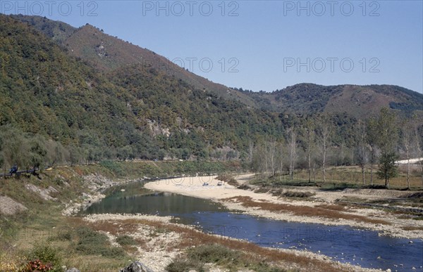 SOUTH KOREA, Han River Valley, Bend in river through steep sided valley floor.