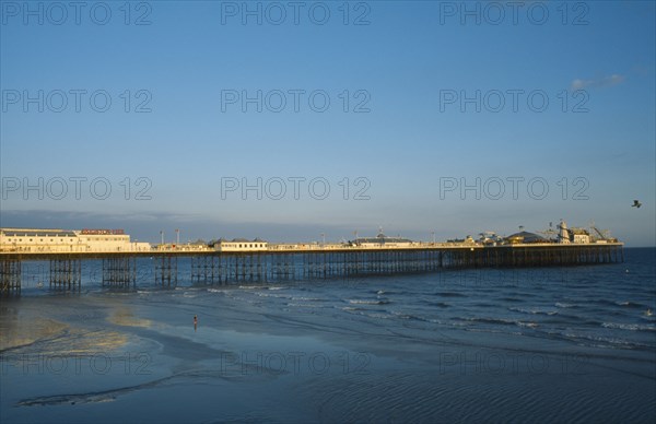 ENGLAND, East Sussex, Brighton, Brighton Pier in early evening light.