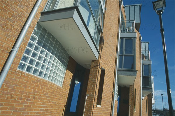 ENGLAND, Hampshire, Portsmouth, Old Portsmouth. Angled view of modern apartment building and street light.