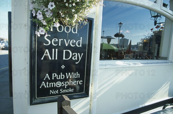 ENGLAND, Hampshire, Portsmouth, Spice Island Tavern. Food served and no smoking policy sign.