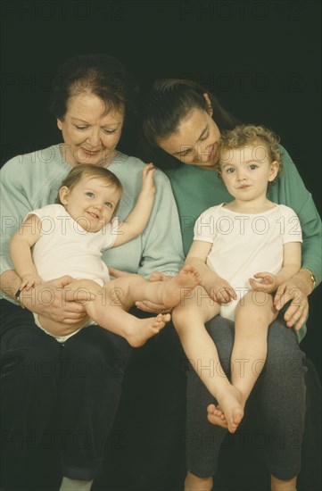 CHILDREN, Relationships, Generations, "Portrait of grandmother, daughter and grandchildren aged thirteen months and two years old.  Three generations."