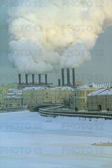 RUSSIA, Moscow, Industrial chimneys emitting thick smoke over Moscow in snow.