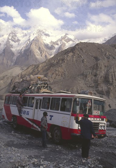 CHINA, Hunza, Karakorum, Bus negotiating a flooded river on the Karakorum highway on route to China from Pakistan