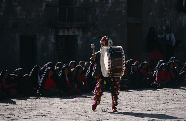 PERU, Music, Masked Taquile drummer performing for Yuyachkani folkloric group.