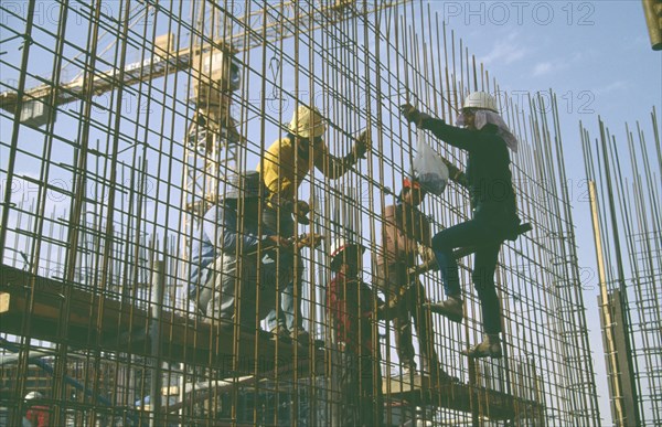 SAUDI ARABIA, Work, Construction workers on building site.