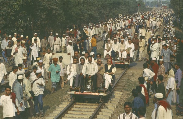 BANGLADESH, Dhaka, Railway inspectors checking and clearing track before train due to huge crowds returning from muslim festival.