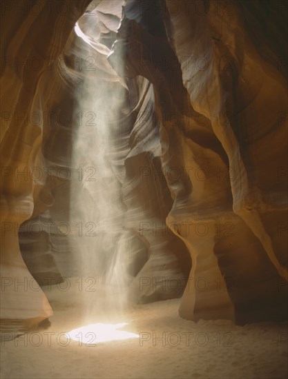 USA, Arizona, Antelope Canyon, Sunshine rays through a hole in the slot canyon