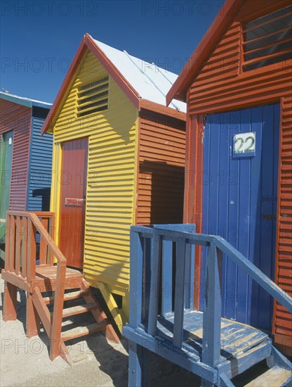 SOUTH AFRICA, Western Cape, Muizenberg, St James Beach. Traditional colourful beach huts.