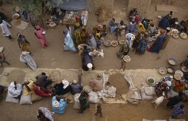 MALI, Sahel Desert, Tonka, "Looking down on traders, customers and stalls at busy rural market. "