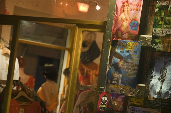 SPAIN, Balearic Islands, Ibiza, "Club flyers, advertising posters outside a boutique, Eivissa."