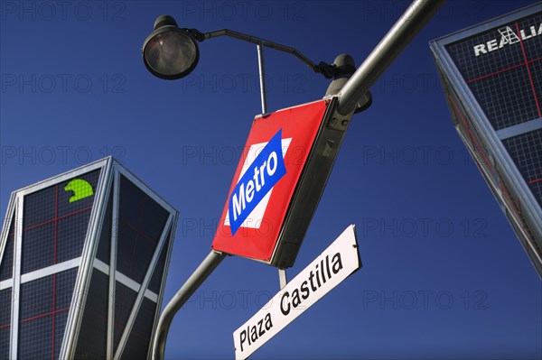SPAIN, Madrid, "City centre metro sign, Plaza Castilla, beneath the Torres Puerta Europa. Underground train station."