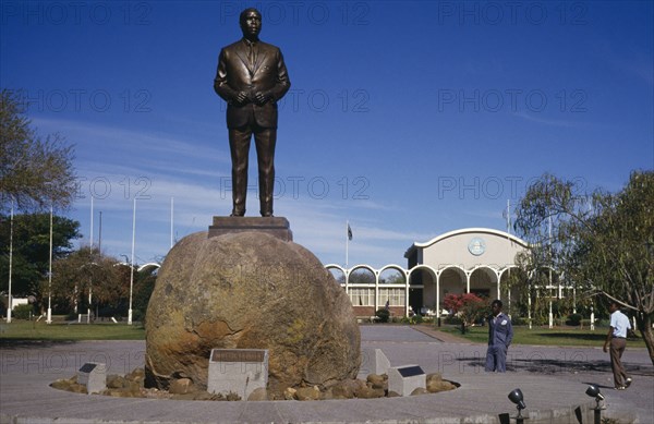 BOTSWANA, Garborone, Statue of Seretse Khama the first President of Botswana with the National Assembly building behind.