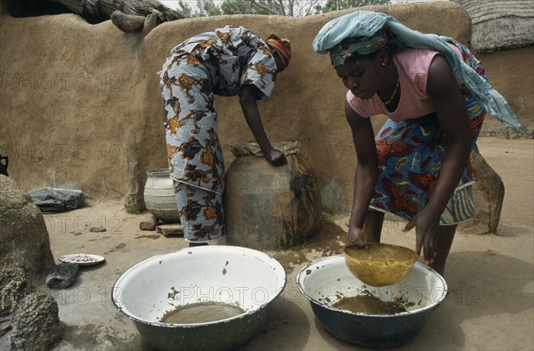 GHANA, Water, "Women filtering water to prevent guinea worm, a parasitic disease contracted when contaminated water is consumed and which can infect stagnant water."