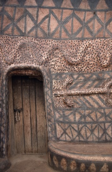 GHANA, North, Architecture, "Detail of traditional mud architecture painted with red and black abstract geometric design and crocodile, the totem symbol of saving the life of a clan member."