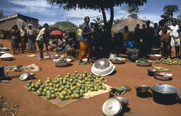 CENTRAL AFRICAN REPUBLIC, Markets, People at market selling fruit and vegtables on the ground with silver containers