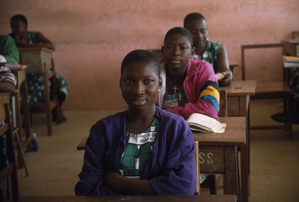 GHANA, North, Jirapa, "Students at St Francis girls secondary school, seated at desks in classroom."