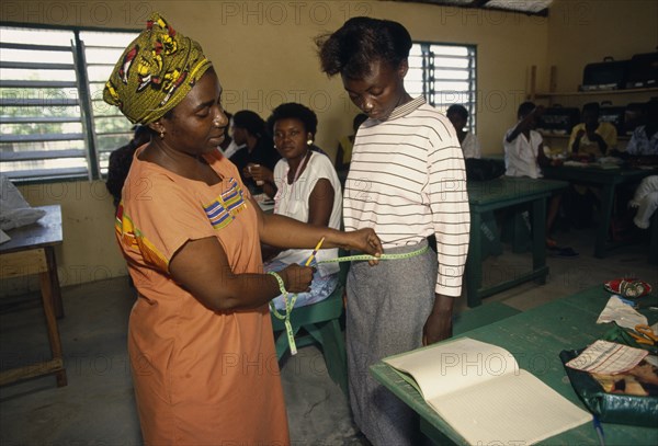 GHANA, Refugees, Liberian refugees in tailoring class in Buduburam camp.