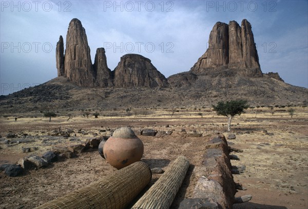 MAURITANIA, Landscape, Arid landscape and rock formations from rooftop of building.