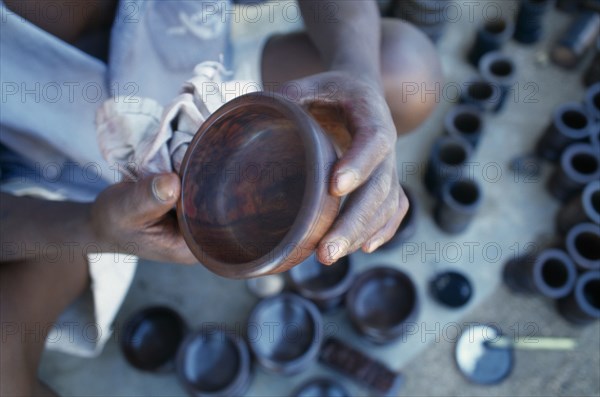 MALAWI, Zalewa, Kadzuwa Crafts.  Cropped view of craftsman producing fair trade carved items for export.