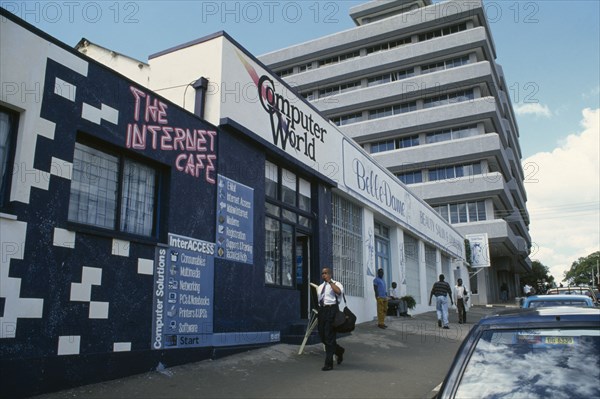 MALAWI, Blantyre, Street scene with internet cafe beside beauty salon.