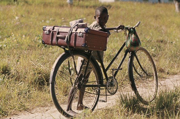 ZAMBIA, Children, Young boy with bicycle.