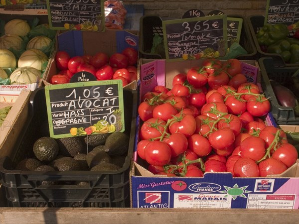 FRANCE, Deux Sevres Region, Poitiers, Tomatoes and Avocados on sale at the market in the town of Rouille.