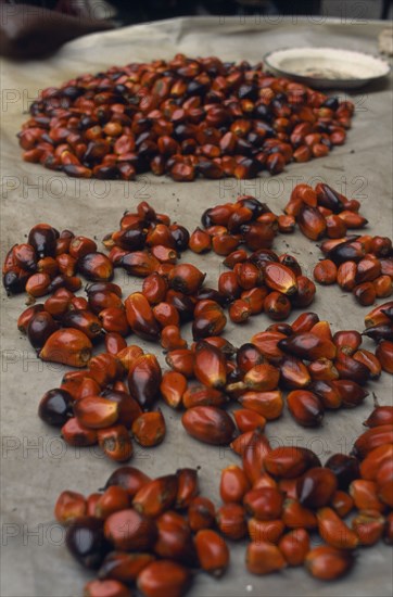 IVORY COAST, Abidjan, Display of palm oil nuts (graine de palme) for sale in the covered market .