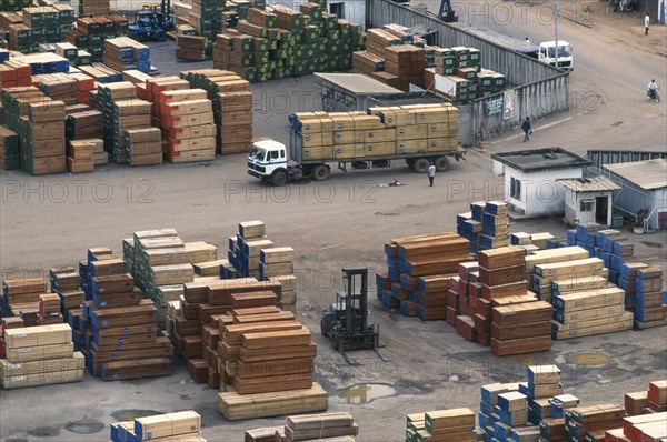 IVORY COAST, San Pédro, Stacked timber waiting for shipment at San Pédro port.