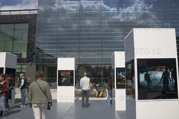 ENGLAND, East Sussex, Brighton, Photographic exhibition of Tsumani images outside the public library as part of the festival.