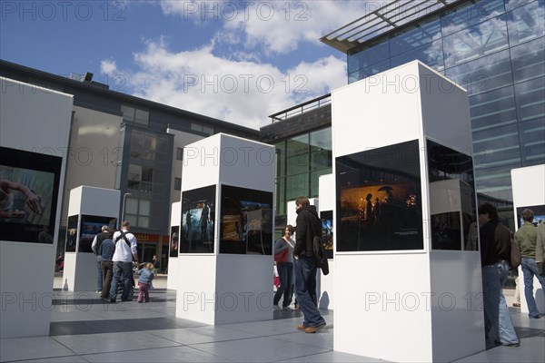 ENGLAND, East Sussex, Brighton, Photographic exhibition of Tsumani images outside the public library as part of the festival.