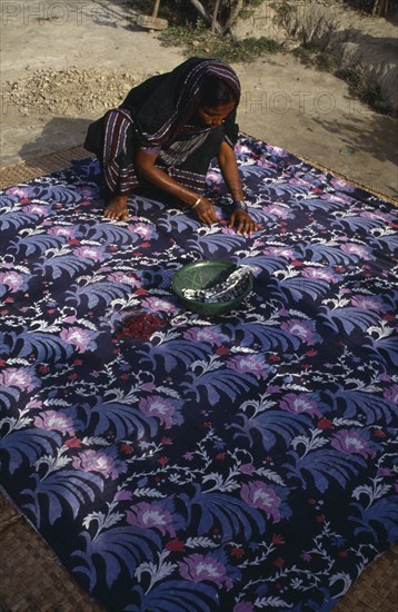 BANGLADESH, Crafts, Bengali woman making traditional quilt.