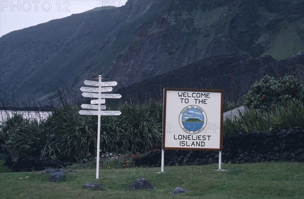 TRISTAN DA CUNHA, Communication, Sign with Welcome to the Loneliest Island written on it next to a direction sign post