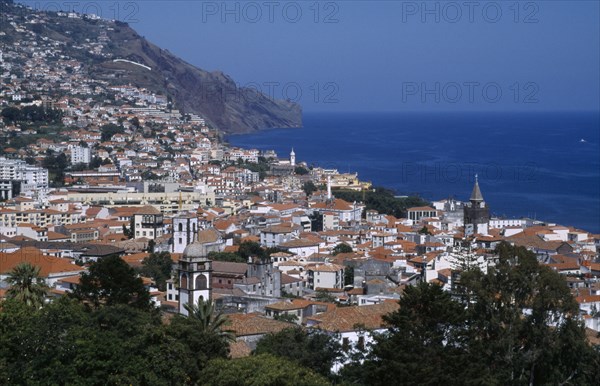 PORTUGAL, Madeira, Funchal, Elevated view over the city centre from the Fortaleza do Pico or Pico Fortress looking west