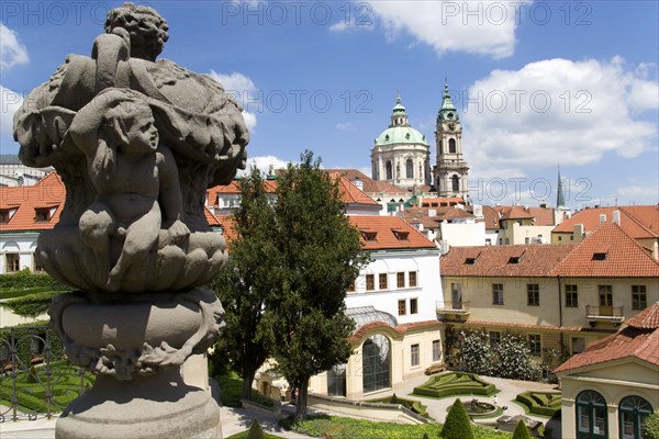CZECH REPUBLIC, Bohemia, Prague, The 18th Century Vrtba Gardens with the Church of St Nicholas beyond in the Little Quarter.