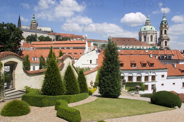 CZECH REPUBLIC, Bohemia, Prague, The 18th Century Vrtba Gardens with St Vitus Cathedral in Prague castle to the left and the Church of St Nicholas on the right in the Little Quarter